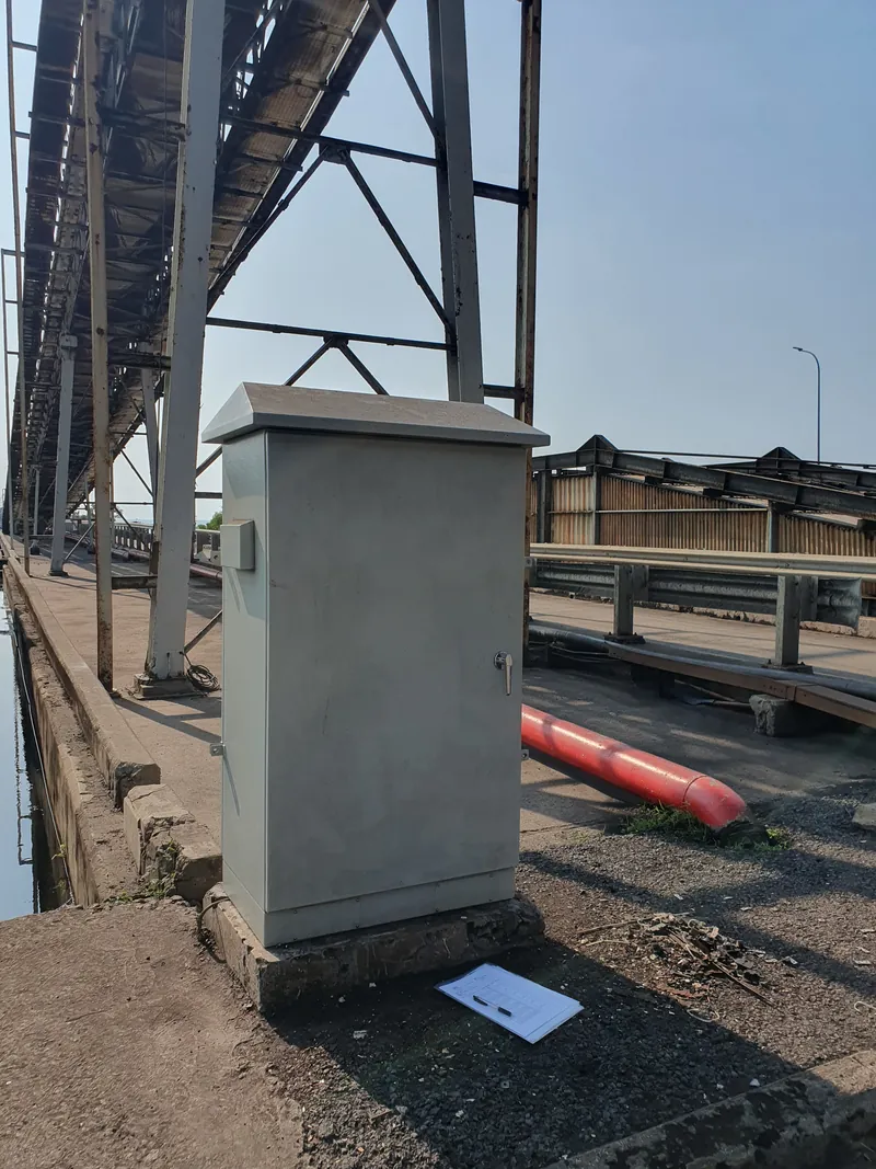 WIRACK outdoor panel enclosure installed beside a coal conveyor